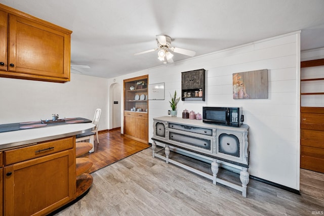 interior space featuring light hardwood / wood-style flooring and ceiling fan