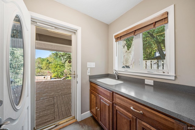 bathroom featuring vanity and a textured ceiling