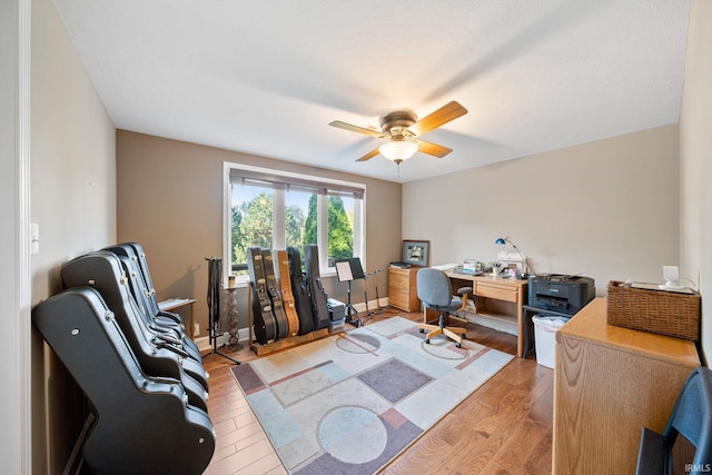 office area with hardwood / wood-style flooring and ceiling fan