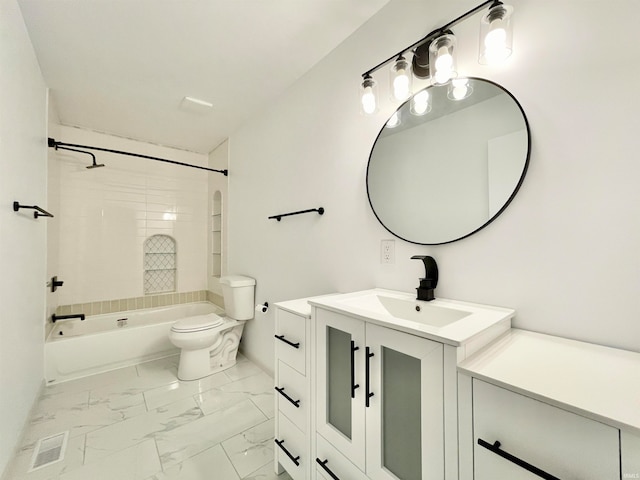 full bathroom with vanity, toilet, and tiled shower / bath combo