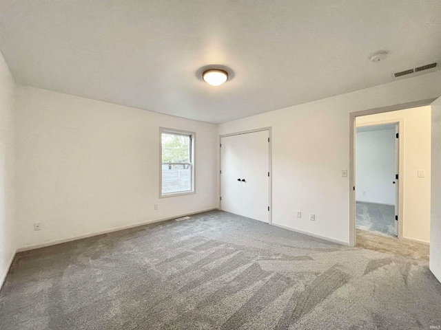 unfurnished bedroom with carpet floors