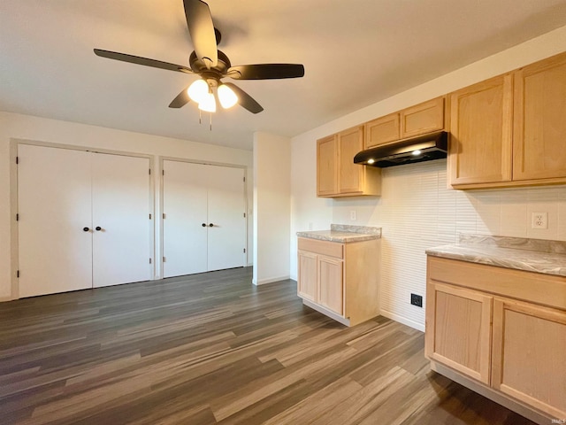 kitchen featuring decorative backsplash, ceiling fan, light brown cabinetry, and dark hardwood / wood-style floors