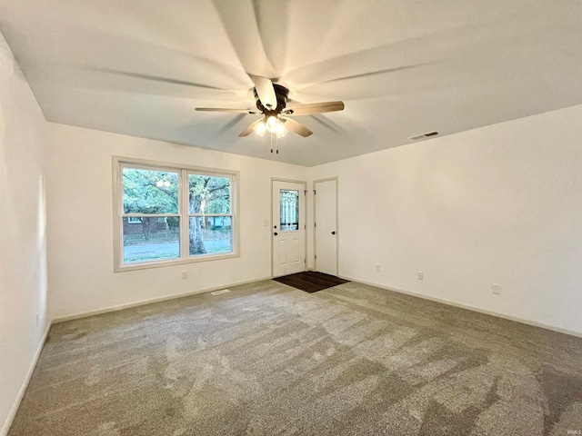 empty room with carpet flooring and ceiling fan