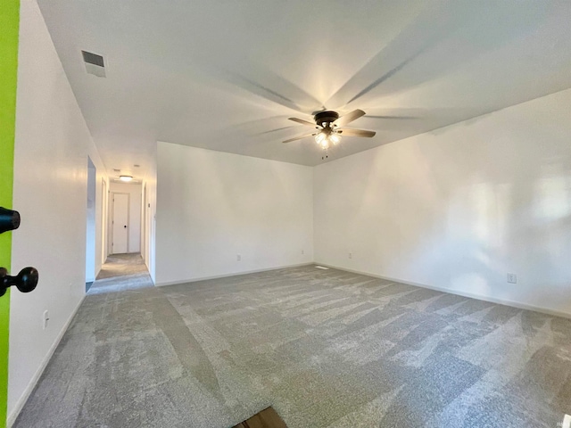 carpeted empty room featuring ceiling fan