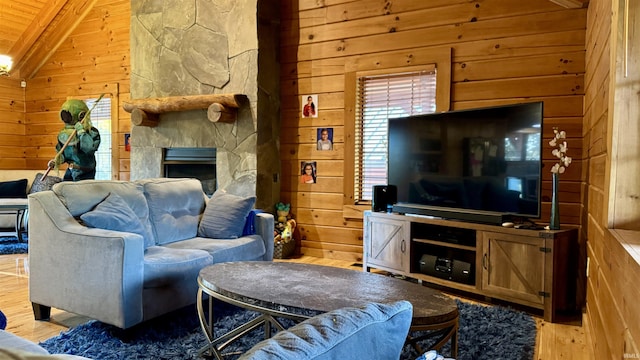 15597 Buck Knob Ln, Loogootee, IN 47553 - living room with wooden walls, wood finished floors, wooden ceiling, and a fireplace