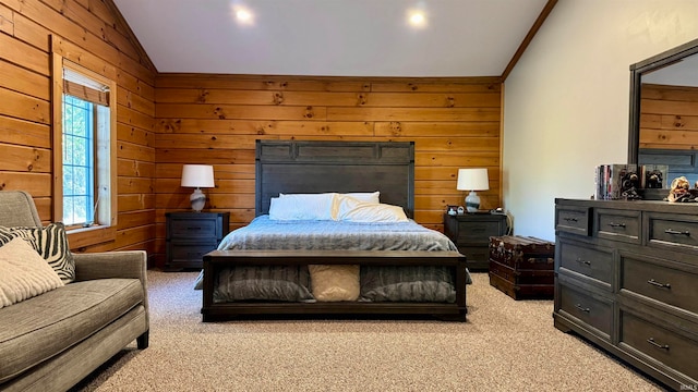 carpeted bedroom with lofted ceiling, crown molding, and wood walls