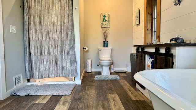 15597 Buck Knob Ln, Loogootee, IN 47553 - full bath featuring wood finished floors and a shower with shower curtain