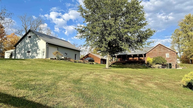 15597 Buck Knob Ln, Loogootee, IN 47553 - view of grassy yard featuring a garage and an outbuilding