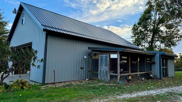 view of side of home with an outbuilding