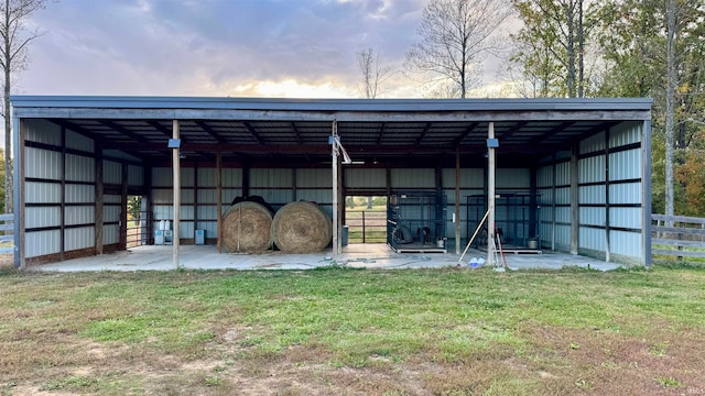 outdoor structure at dusk with a lawn