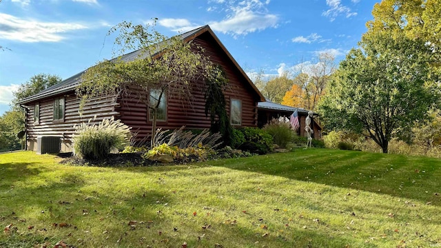 view of property exterior with a lawn