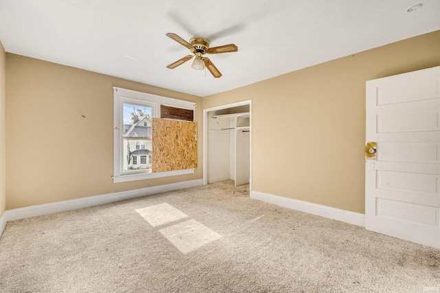 unfurnished bedroom with carpet floors, ceiling fan, and a closet