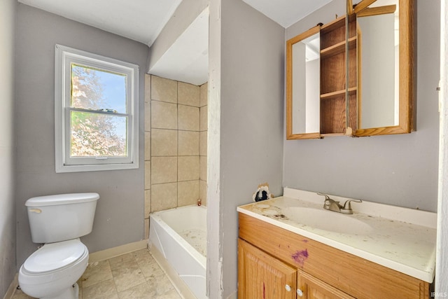 full bathroom featuring tile patterned flooring, vanity, toilet, and tiled shower / bath combo