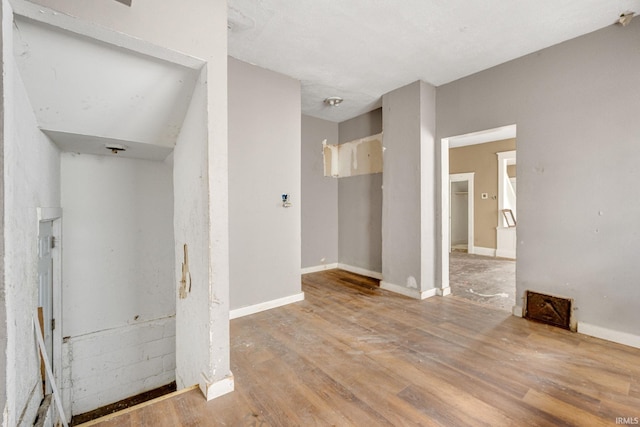 unfurnished room featuring wood-type flooring