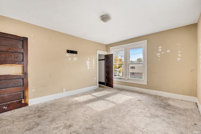 unfurnished bedroom with light colored carpet