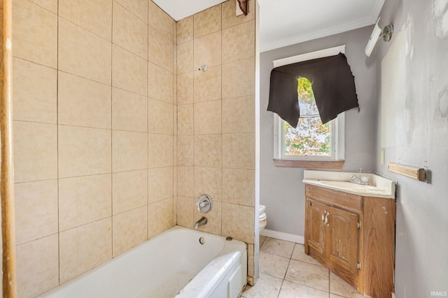 full bathroom featuring crown molding, vanity, tile patterned flooring, toilet, and tiled shower / bath