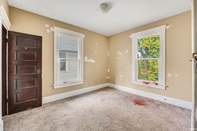 empty room with carpet flooring