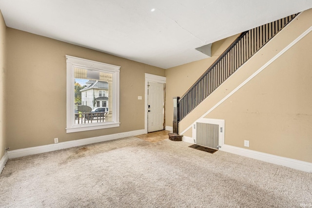 view of carpeted foyer