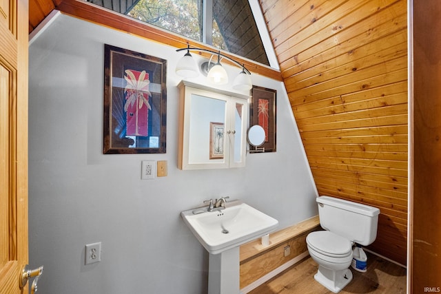 bathroom featuring toilet, wood-type flooring, wooden ceiling, and vaulted ceiling