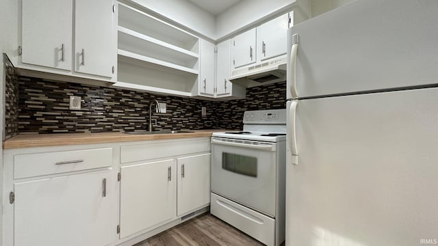 kitchen featuring white appliances, tasteful backsplash, sink, light hardwood / wood-style floors, and white cabinets