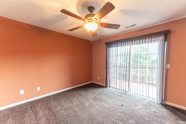 carpeted empty room featuring ceiling fan