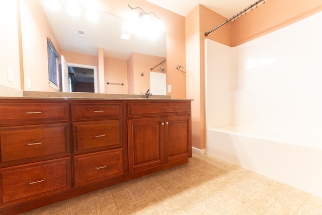 bathroom with vanity and shower / tub combination