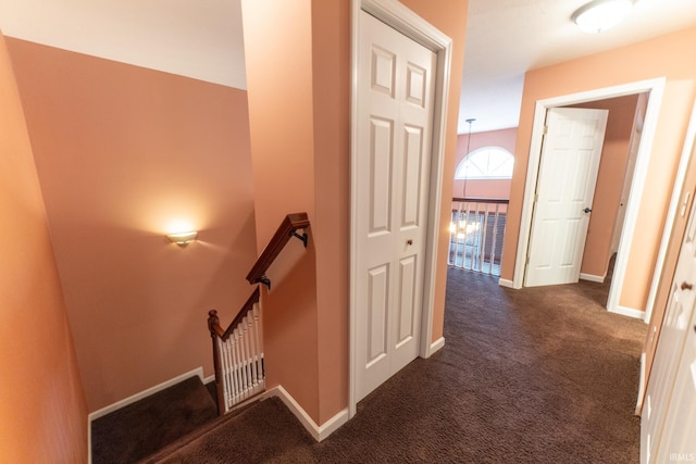 hallway with dark carpet