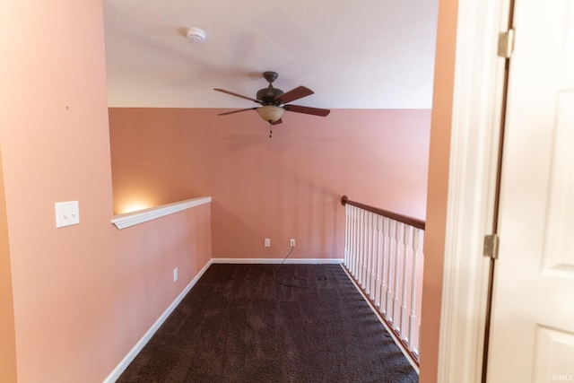 corridor with dark colored carpet