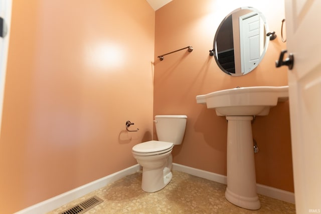 bathroom featuring toilet