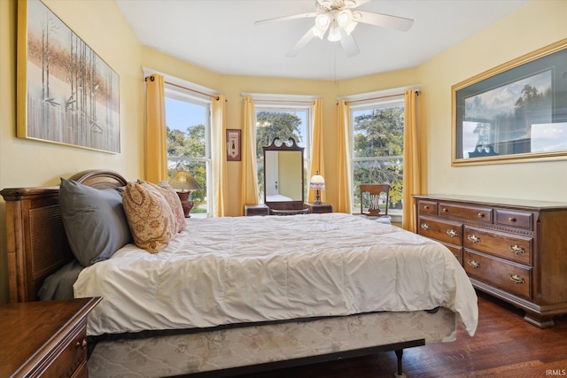 bedroom with dark wood-type flooring and ceiling fan