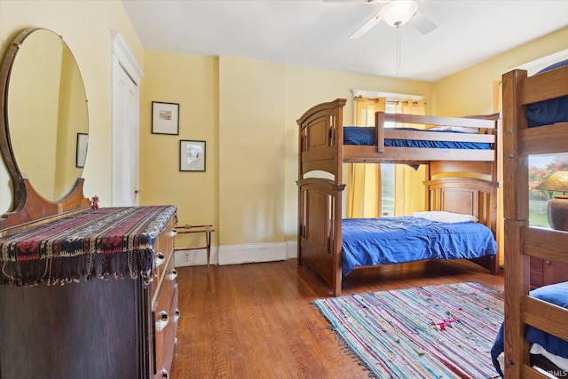 bedroom featuring ceiling fan and dark hardwood / wood-style flooring