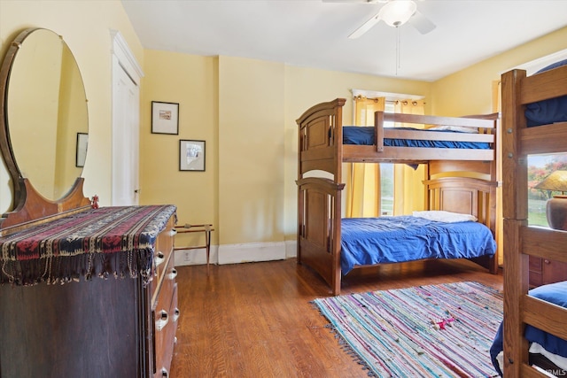1025 W Lincolnway, Mishawaka, IN 46545 - bedroom featuring baseboards, ceiling fan, and wood finished floors