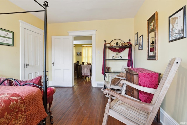 bedroom featuring dark wood-type flooring