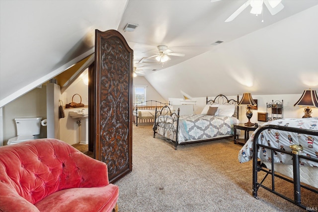 carpeted bedroom featuring ceiling fan and vaulted ceiling