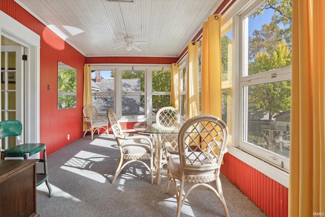 sunroom with ceiling fan and plenty of natural light