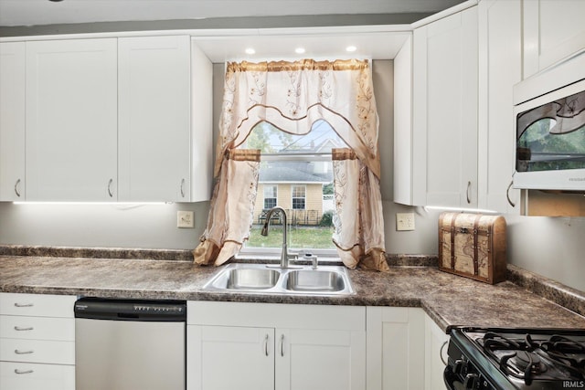 kitchen with black range, sink, stainless steel dishwasher, and white cabinets