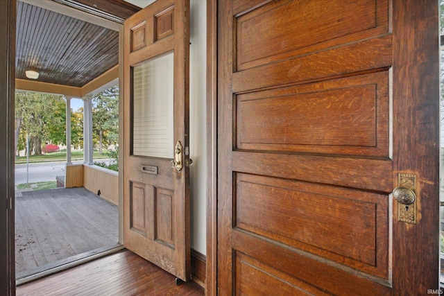 entryway with dark hardwood / wood-style flooring