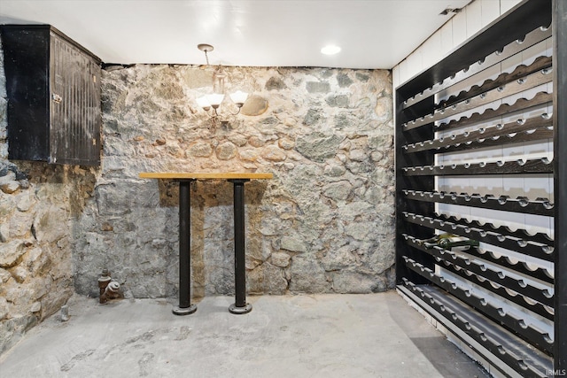 wine room featuring concrete flooring