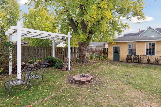 view of yard with a patio area, a fire pit, and a pergola