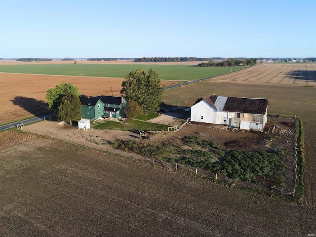 birds eye view of property with a rural view