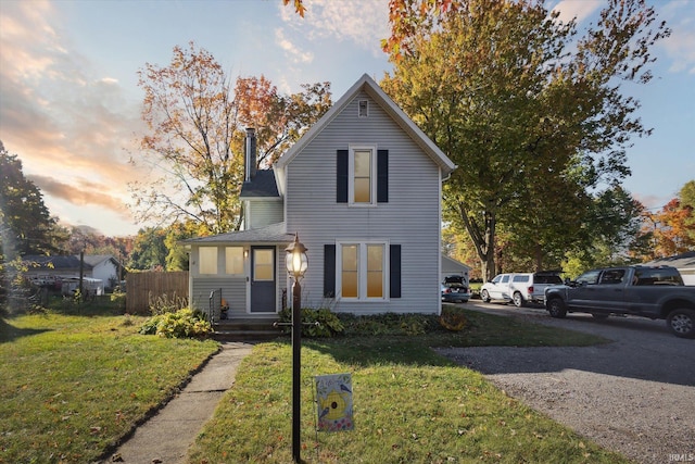 view of front of home with a yard