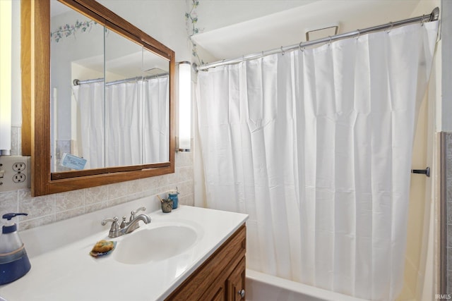 bathroom with vanity and shower / bath combo with shower curtain