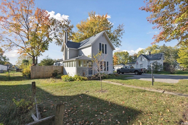 view of property exterior featuring a yard