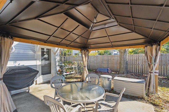 view of patio featuring a gazebo and a grill