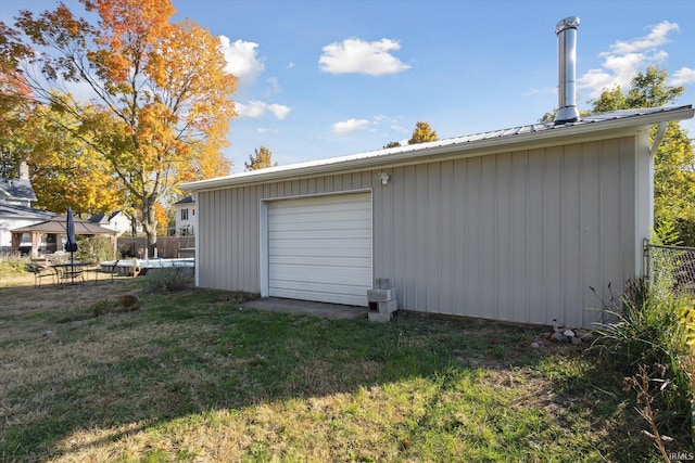 garage with a lawn