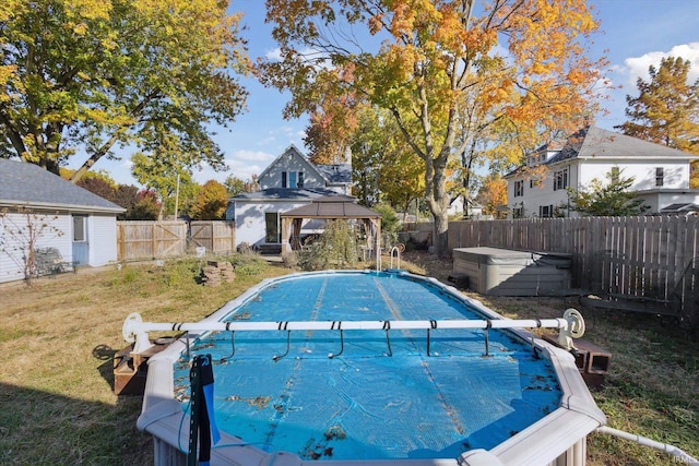 view of pool with a gazebo and a lawn