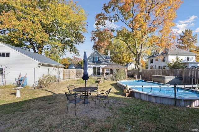 view of yard with a fenced in pool and a patio area