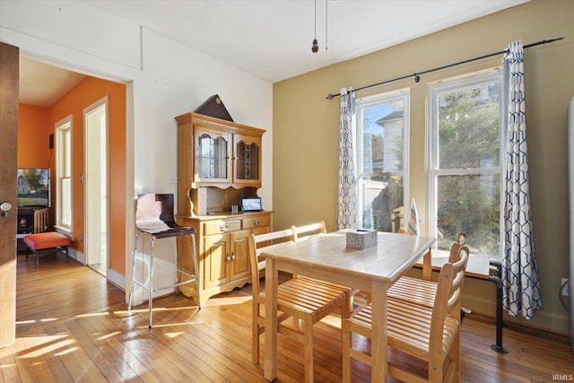 dining space featuring light wood-type flooring