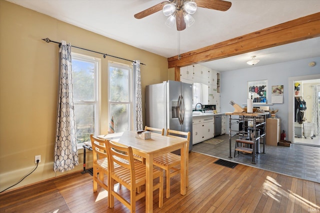 dining area featuring light hardwood / wood-style flooring and plenty of natural light