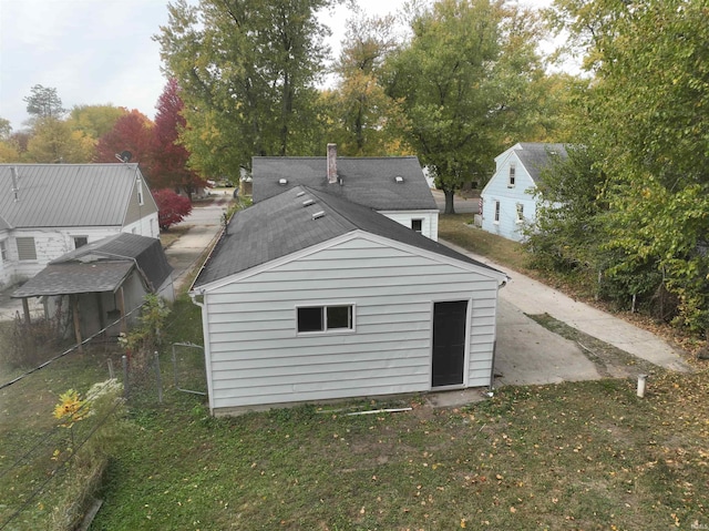 rear view of property with a lawn